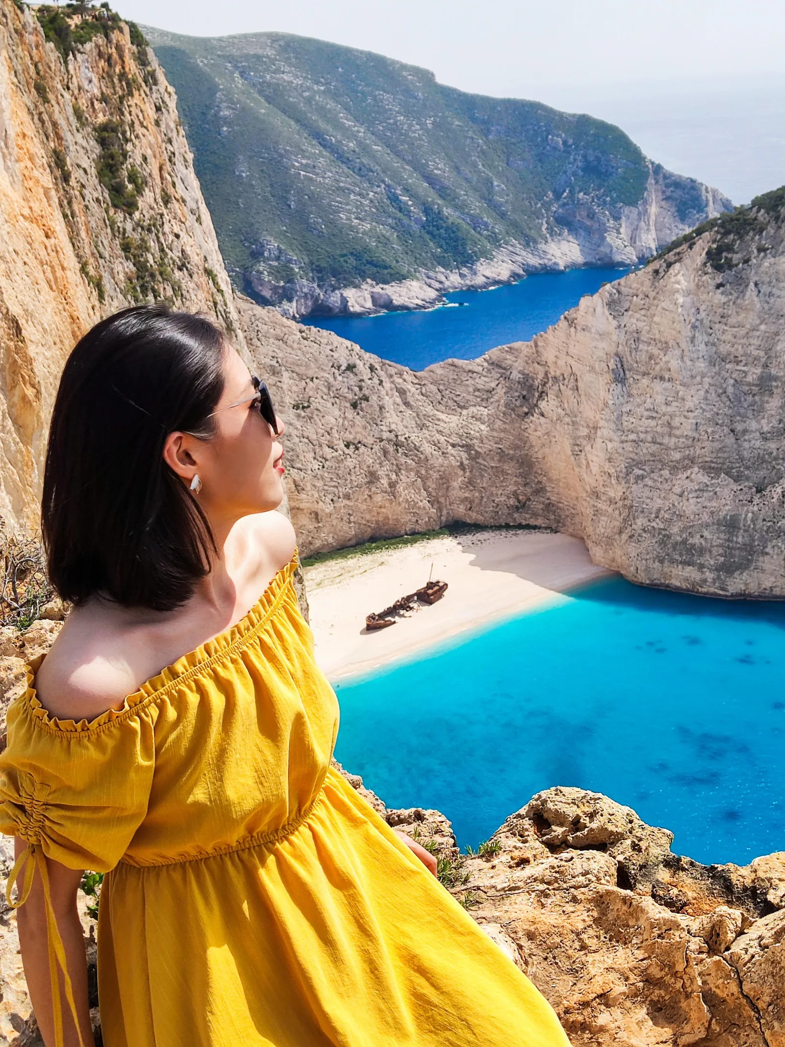 Minibus tour group at a Zakynthos clifftop viewpoint